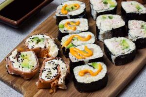Low Carb Sushi Rolls displayed on wooden board