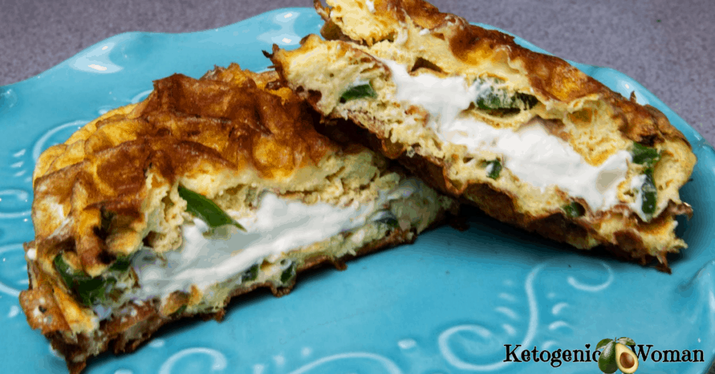 Jalapeno popper cut in half on blue plate