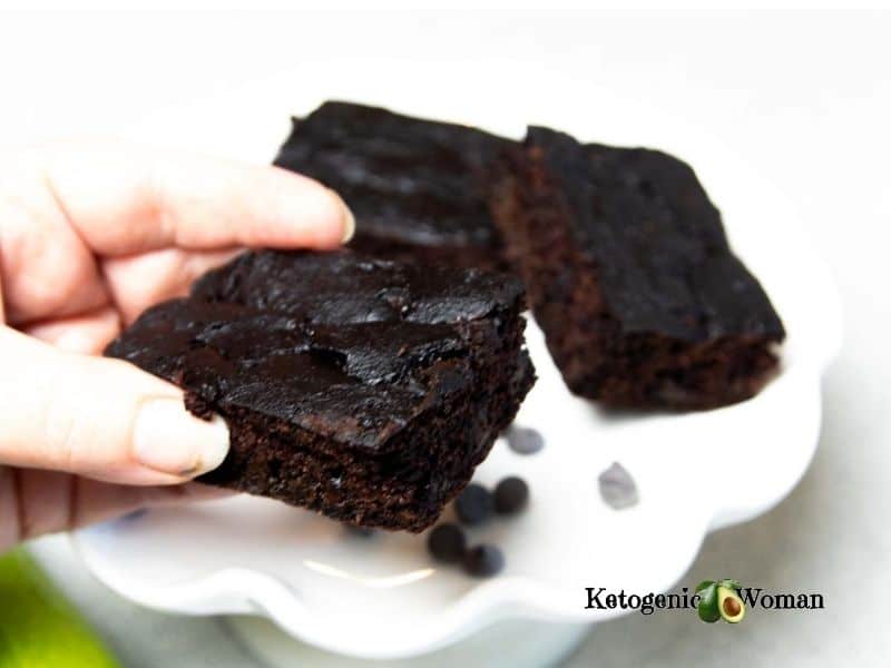 A piece of chocolate zucchini brownie on a white plate