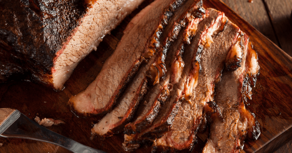 Cooked Brisket Slices on Wooden Board