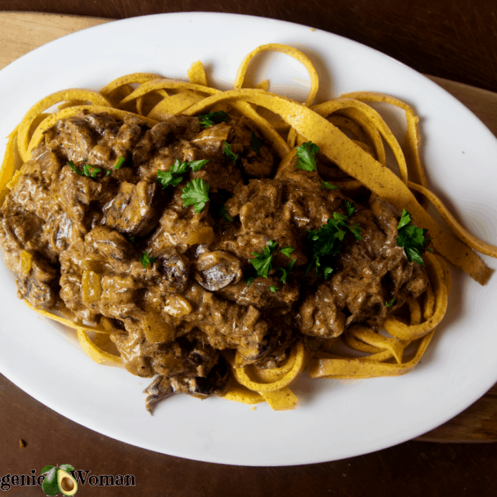 Beef Stroganoff over Noodles on White Platter