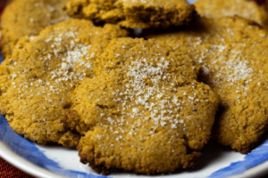 Keto Pumpkin Spice Cookies dusted with sugar on plate