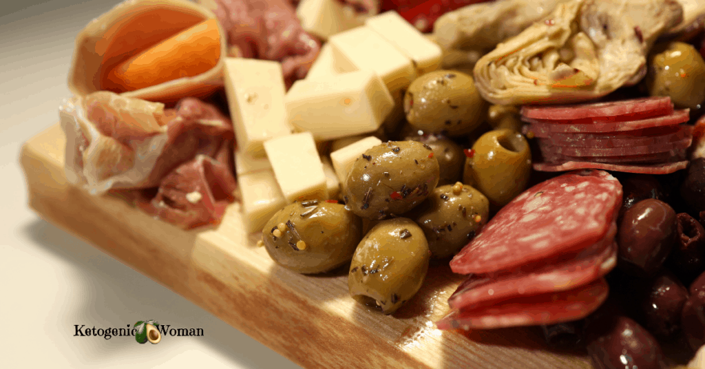 meat and cheese laid out on wooden board
