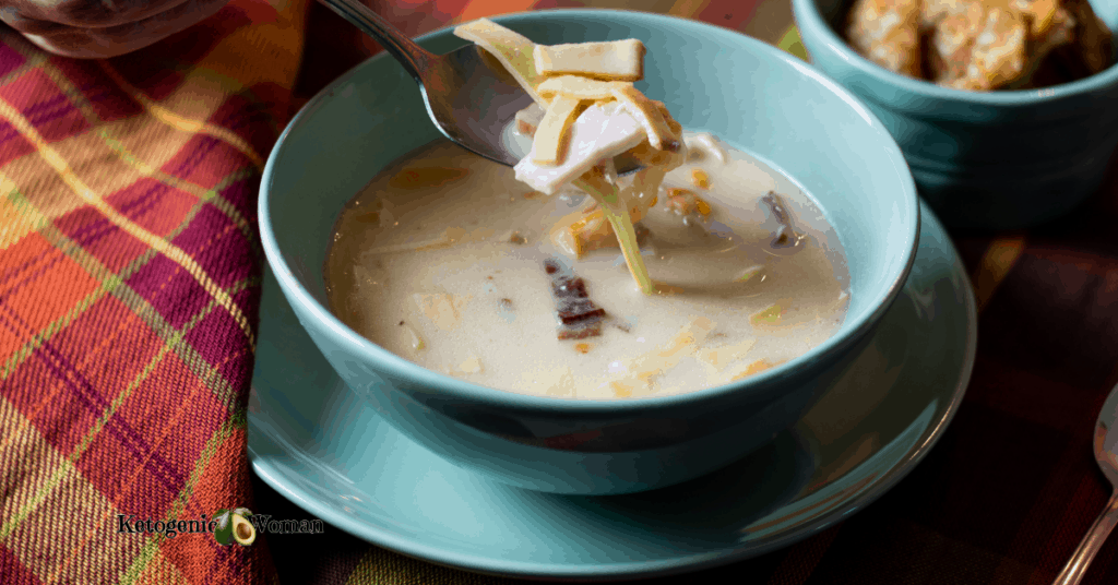 bowl of ham and cheese soup on plaid placemat 