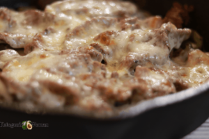 closeup shot of cheesesteak in pan