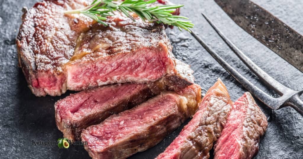 Slices of steak on wooden board