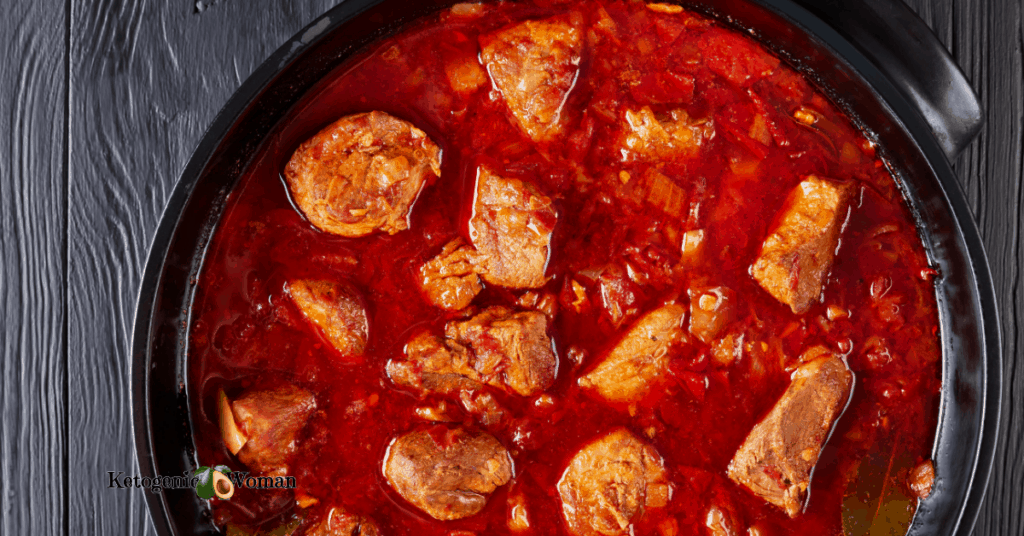 bowl of hearty stew against dark background
