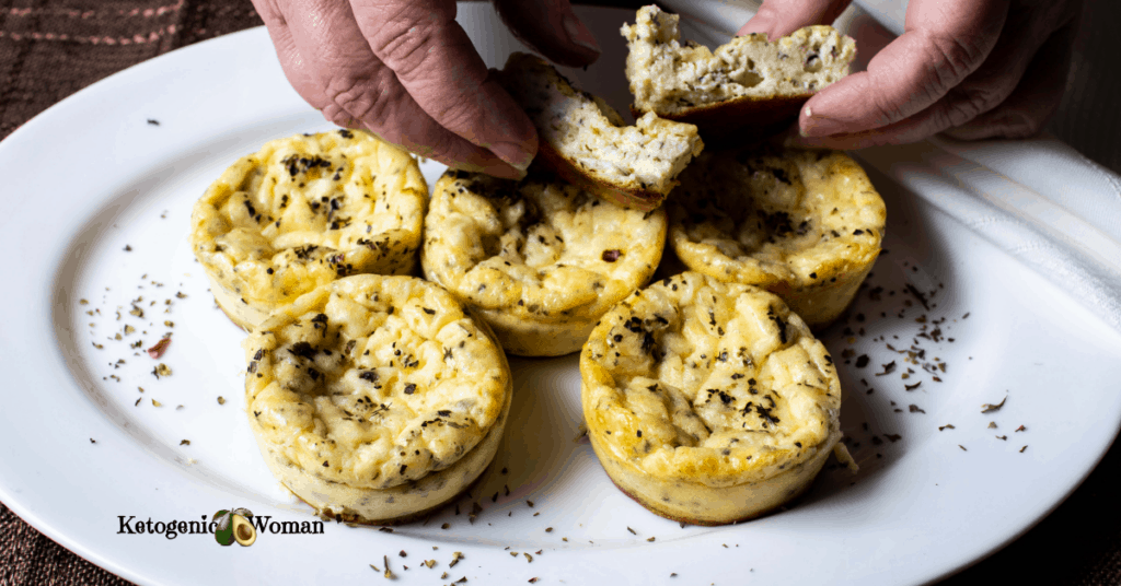 platter of muffins with hands breaking one apart